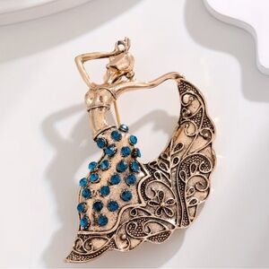 Elegant Gold and Blue Dancer Brooch